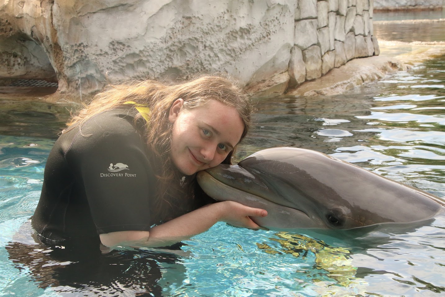 Portrait of Bree Sternbaer and a dolphin